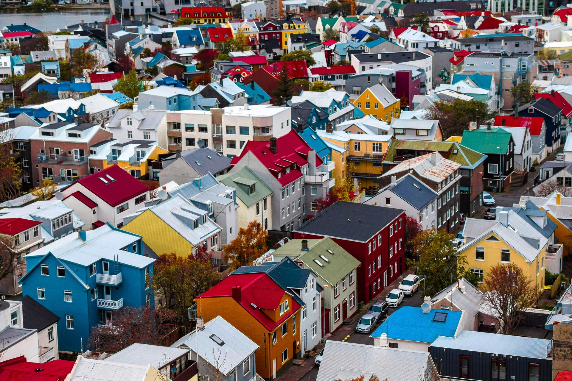 Colorful rooftops of houses in a dense urban neighborhood. Reykjavik, Iceland.