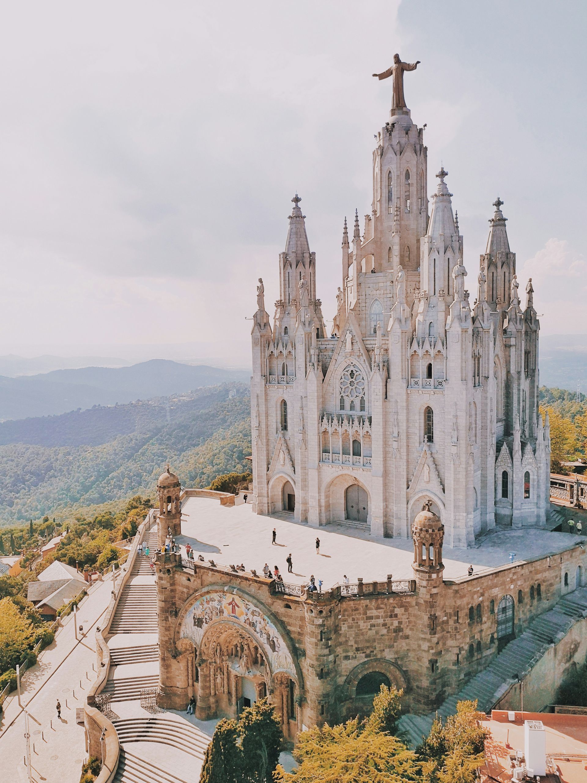 Temple Expiatori del Sagrat Cor on a hilltop overlooking mountains, Barcelona.