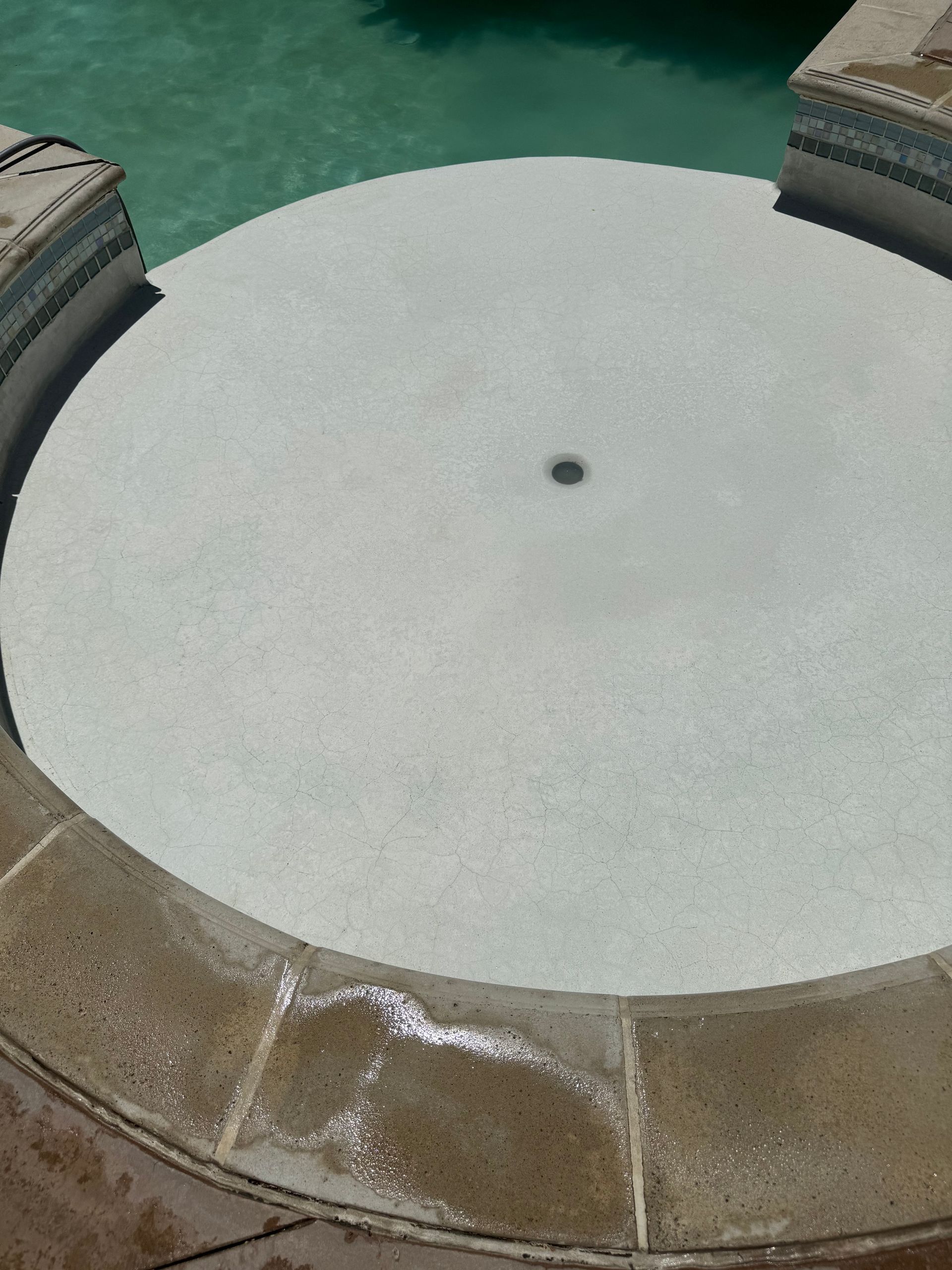 A clean circular swimming pool