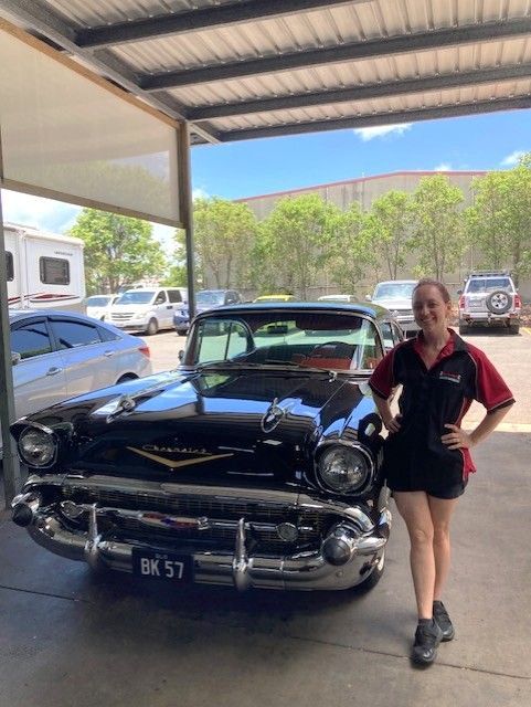 Two Men Are Looking At A Clipboard In A Garage — Bay City Quality Mobile Mechanic In Pialba, QLD