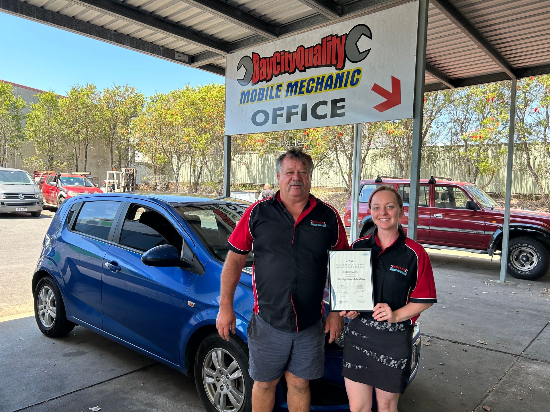 A Person Is Working On A Car Engine With A Wrench — Bay City Quality Mobile Mechanic In Pialba, QLD