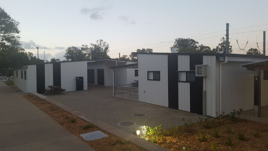 A Row Of Black And White Sheds Are Lined Up Next To Each Other — Bushman Sheds in Bundaberg East, QLD