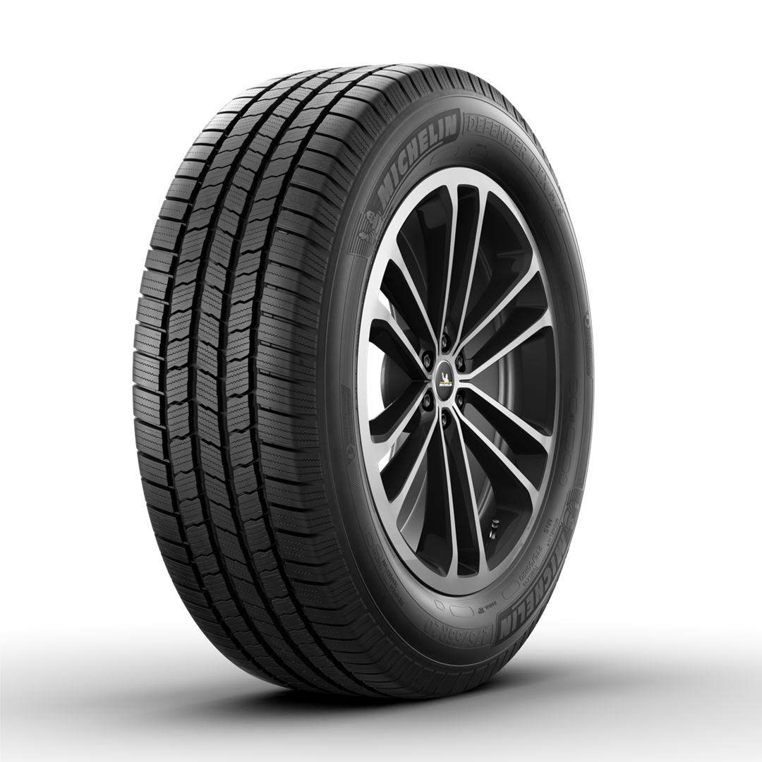 A black Michelin tire mounted on a dark, multi-spoke alloy rim against a white background. | Military Brake & Alignment Services Inc.
