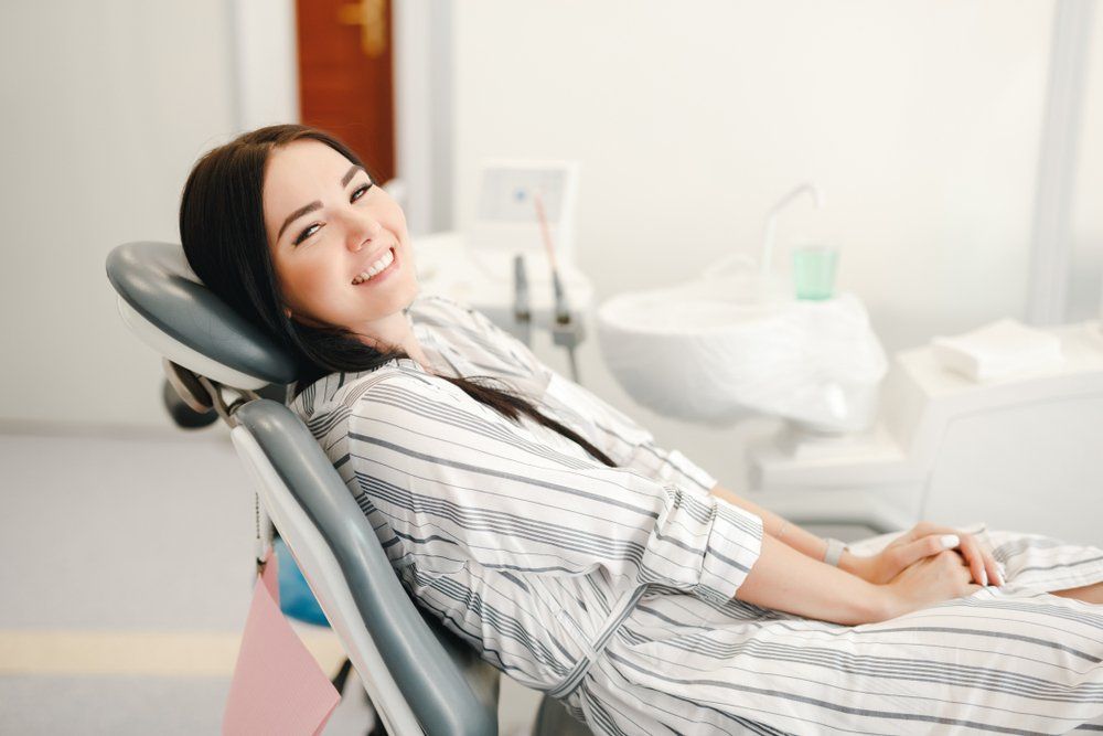 Smiling and Satisfied Patient — Dentistry Services in Cairns, QLD