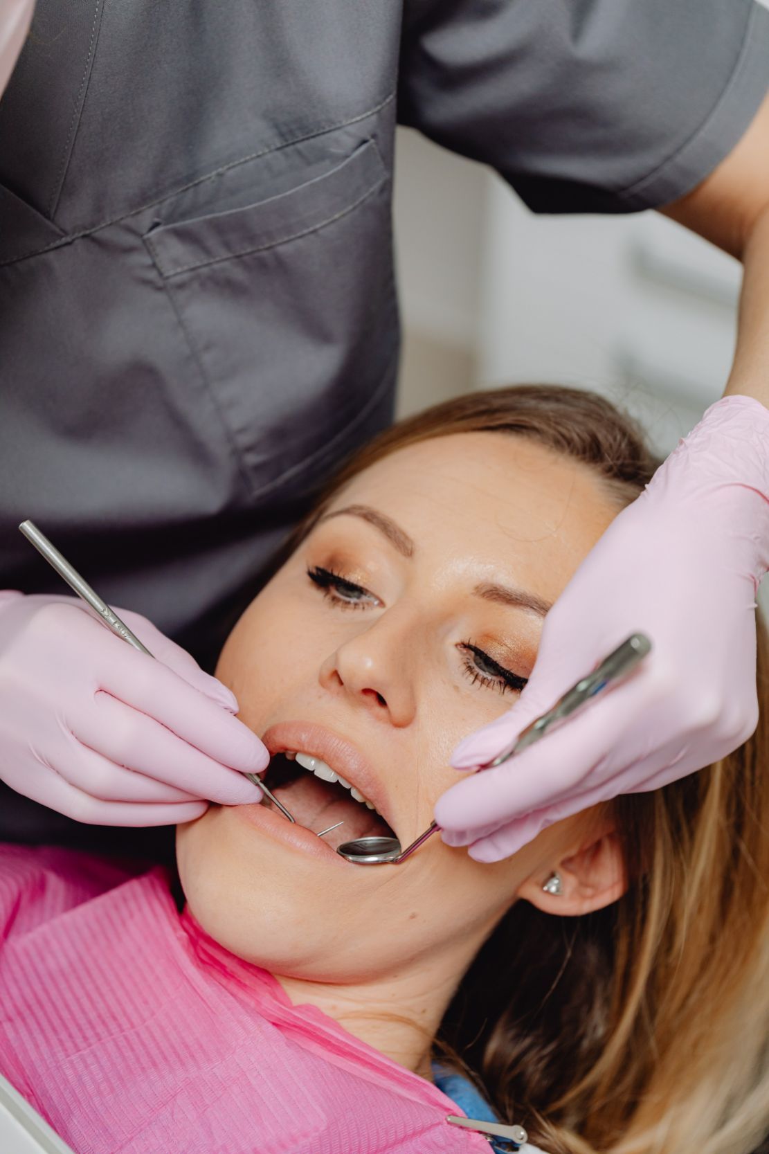 Woman Having Teeth Examined — Dentistry Services in Cairns, QLD