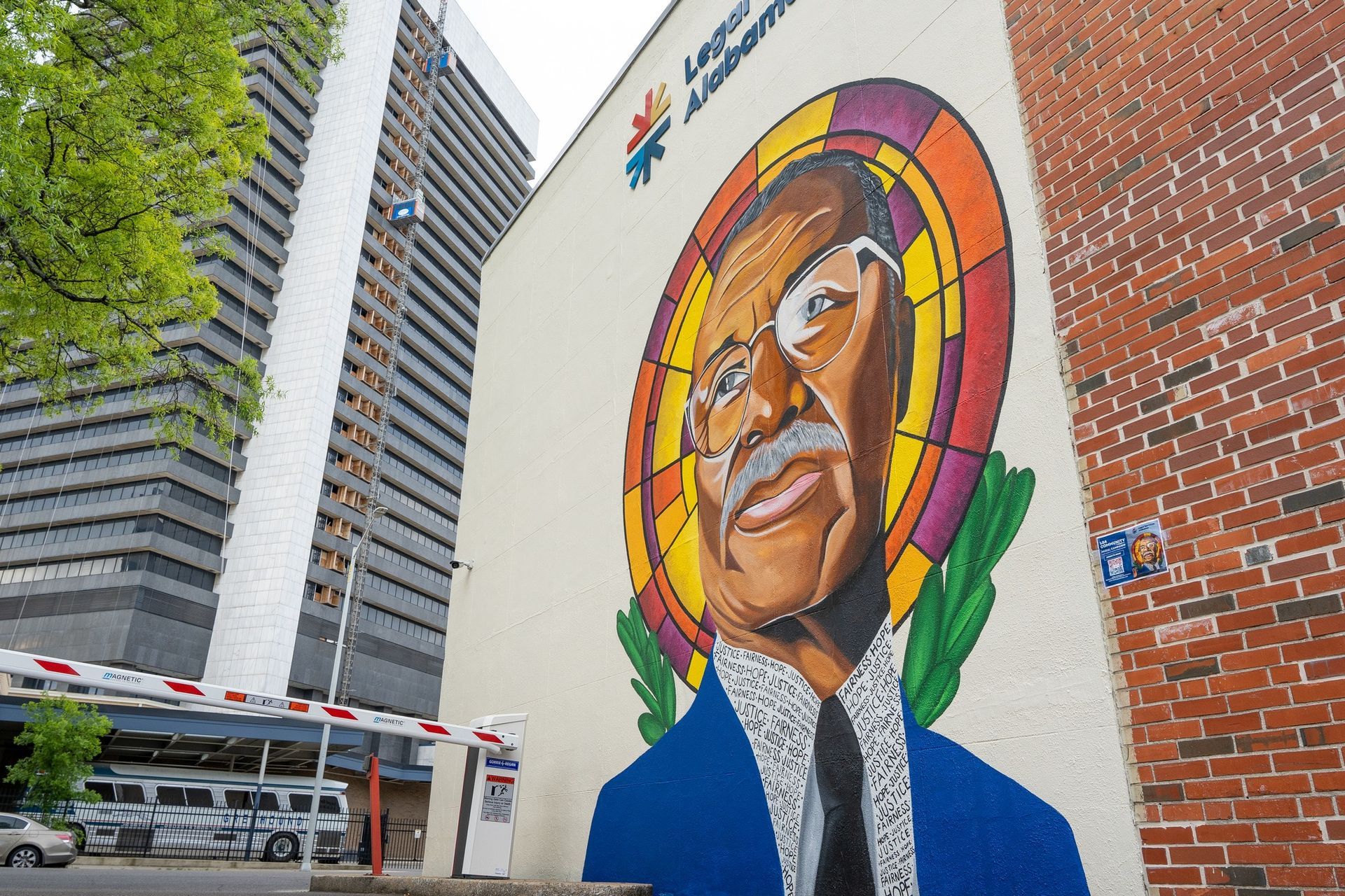 Color photo of Rev. Fred Shuttlesworth mural on side of brick building
