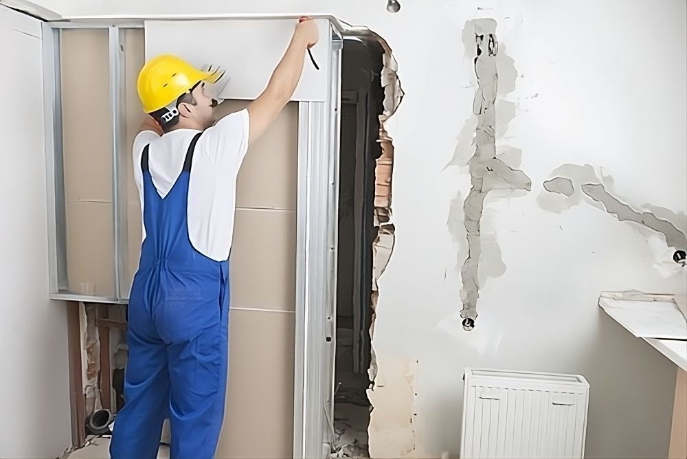 Men Painting In Empty Home Interior