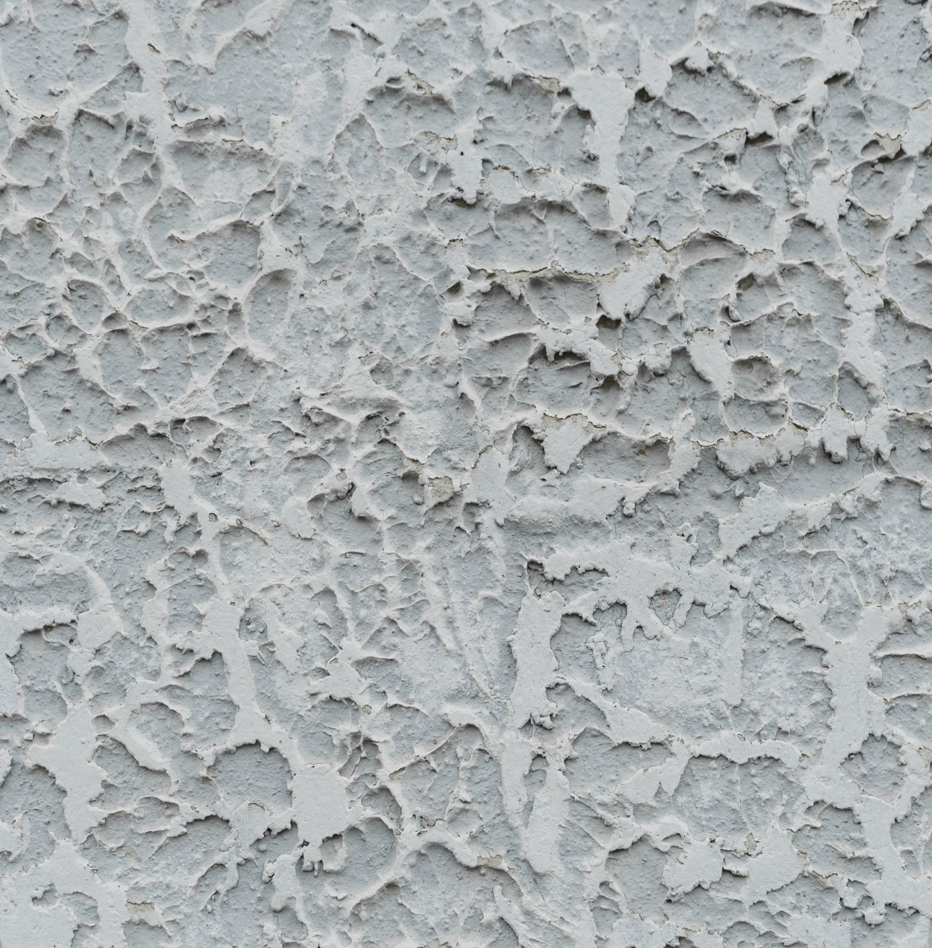 Cracked gray stucco wall