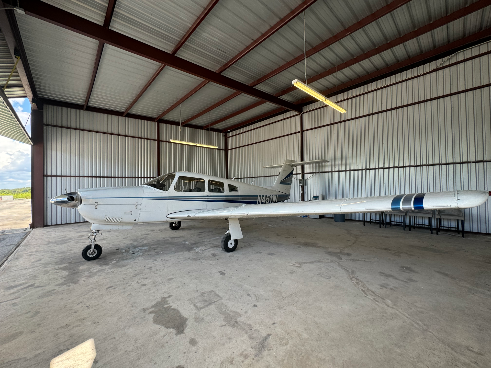 A small plane is parked in a hangar.