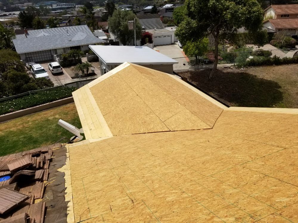 An aerial view of a roof with shingles on it