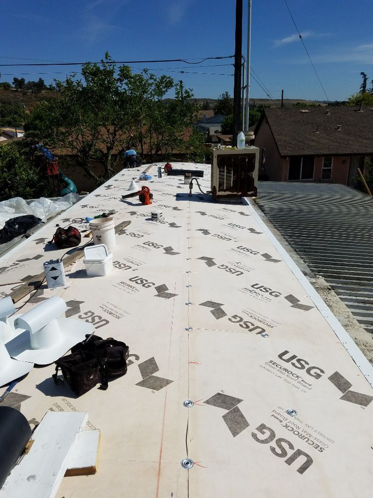 The roof of a house is being covered with usg foam.