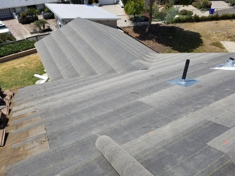 An aerial view of a roof with a chimney on it