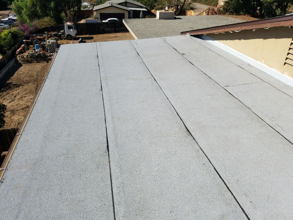 The roof of a house with a gray roof