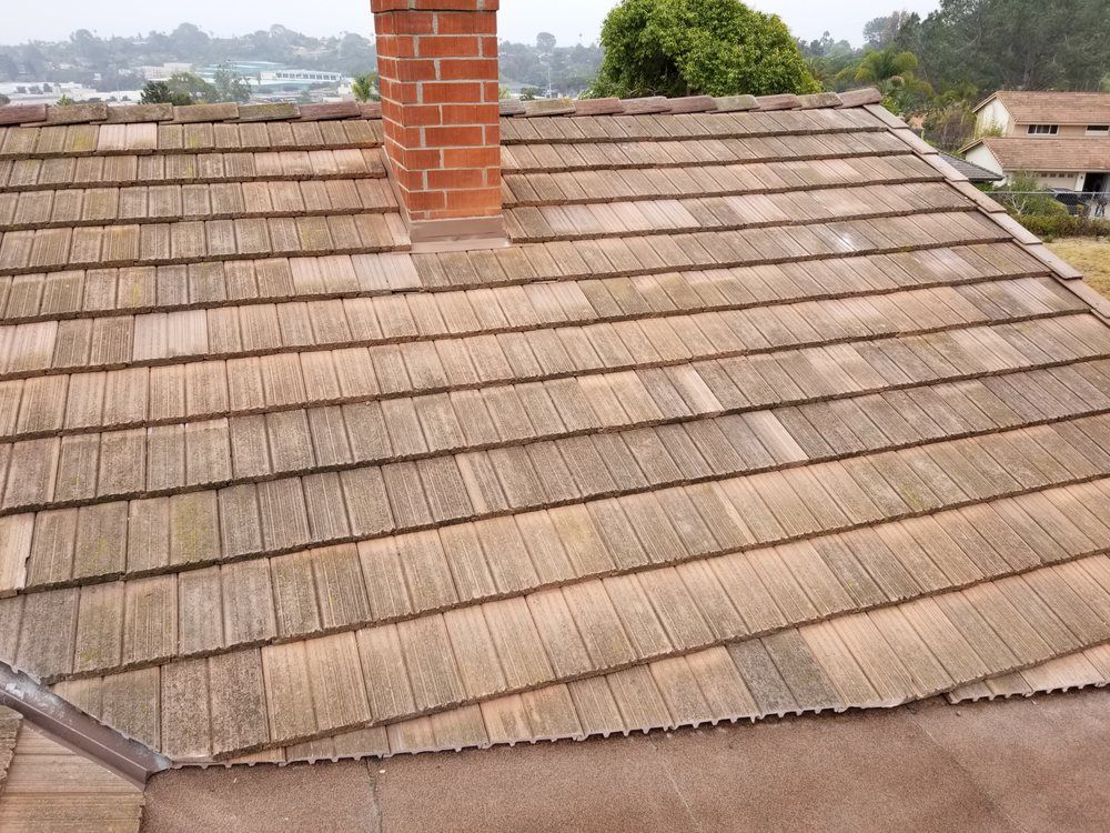 A wooden roof with a chimney on top of it