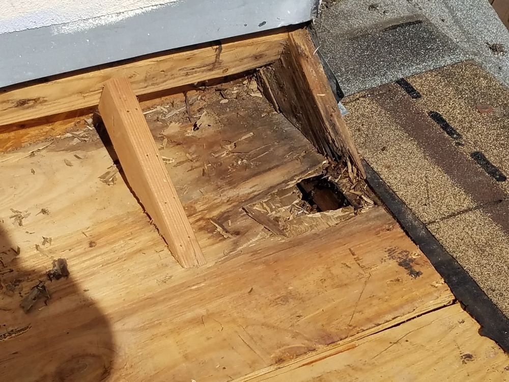 A piece of wood is sitting on top of a wooden floor.