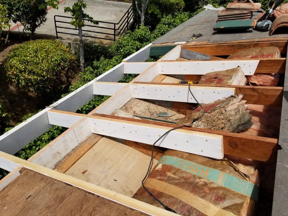 A roof with a lot of wooden beams on it