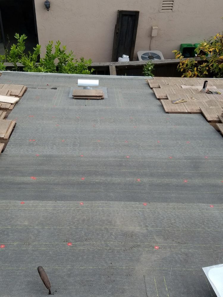 A roof with a few pieces of cardboard on it