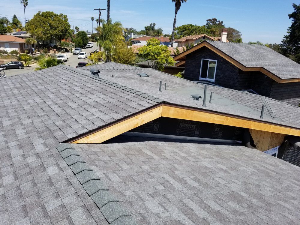 A roof of a house with a lot of shingles on it.