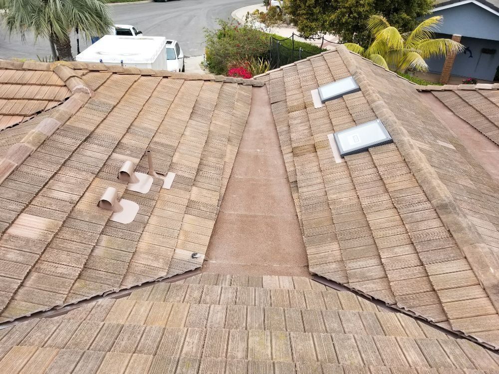 A roof with a few skylights on it