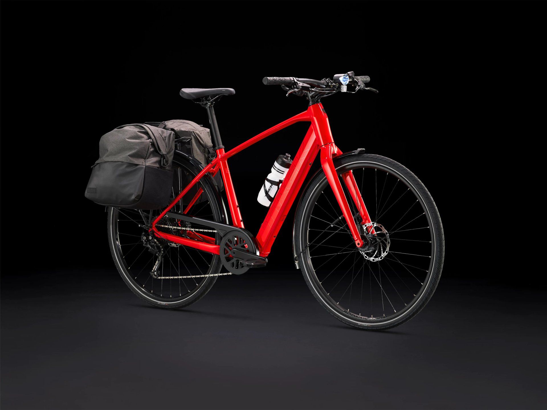 a red bicycle with a black bag on the back