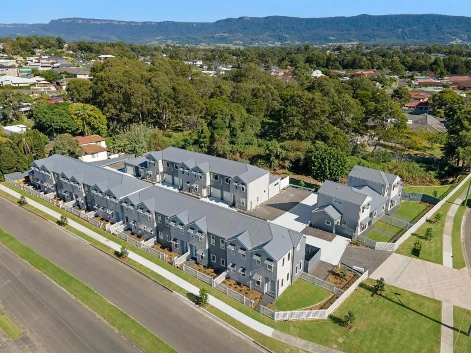 An Aerial View of a Row of Houses in a Residential Area — Sheps Roofing Service Pty Ltd In Kiama, NSW