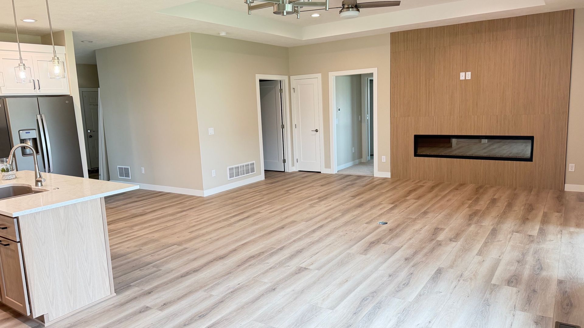 FO-level slab-on-grade twin home interior main living area. 