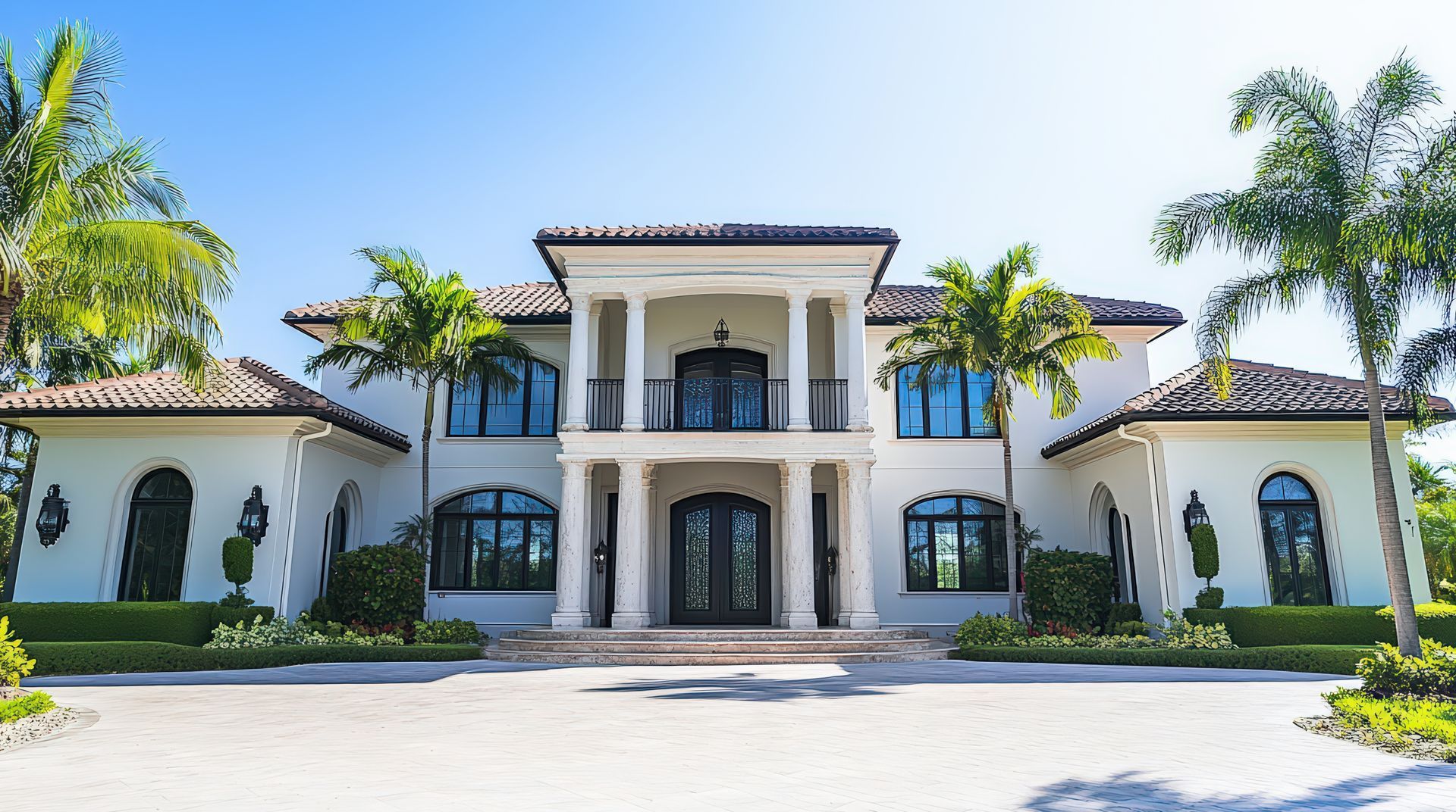 Large white two-story house with columns.