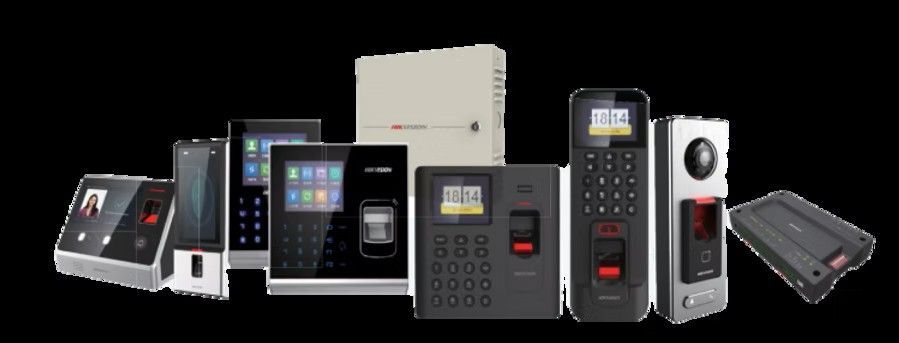 Hand swiping access card on a security door panel. Blue light illuminates the device.