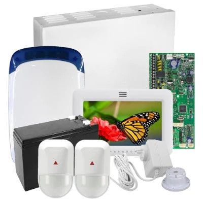 Woman entering code on a security system keypad mounted on a wall.