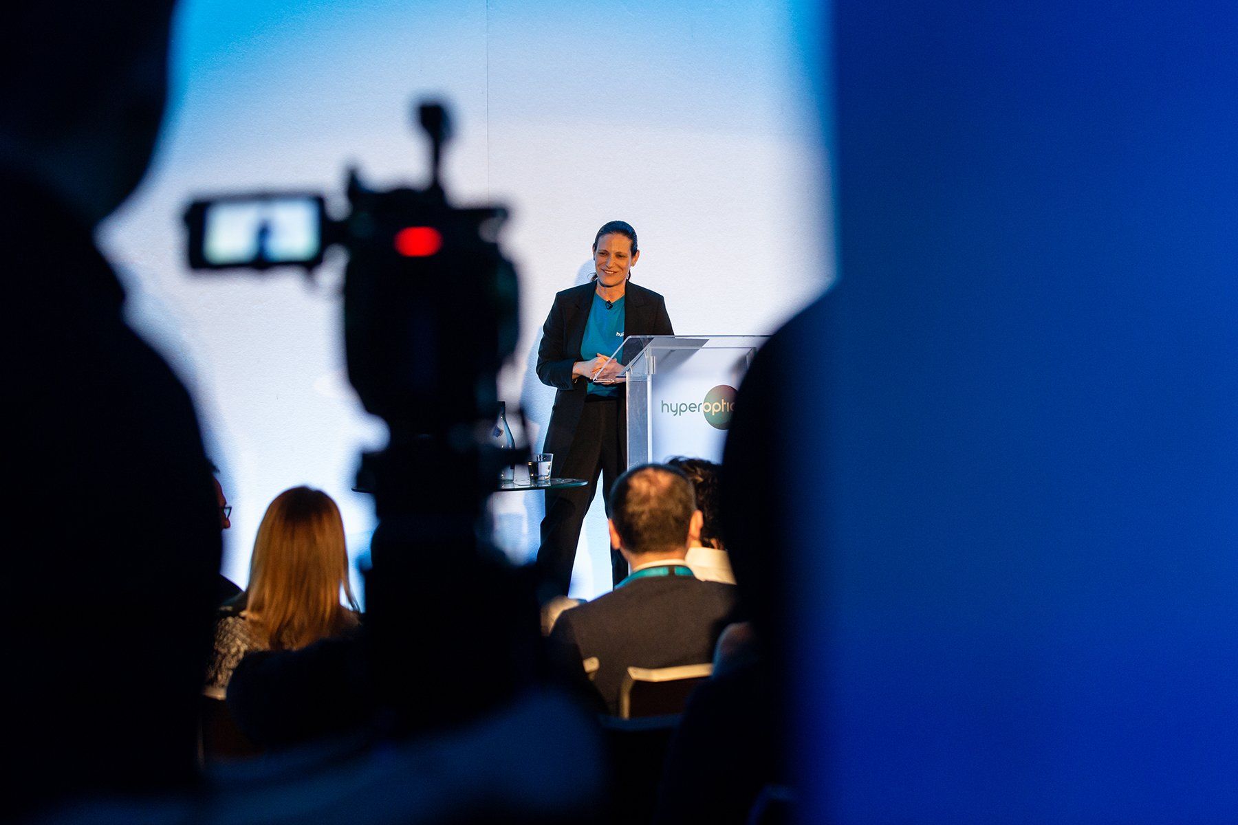 Professional photographer near me female presenting to video camera