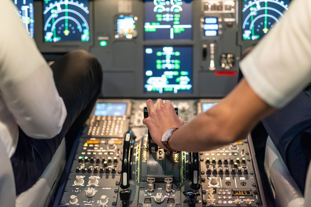 close up image of plane controls in cockpit area