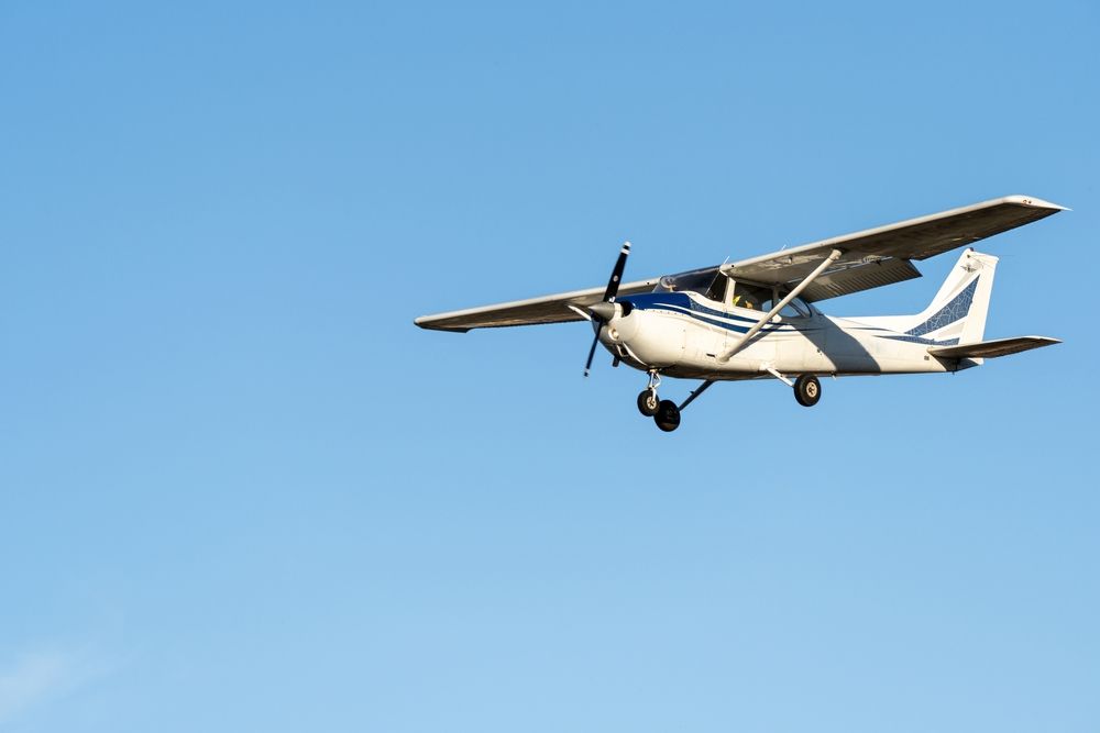 small aircraft flying in the air demonstrating roll pitch and yaw