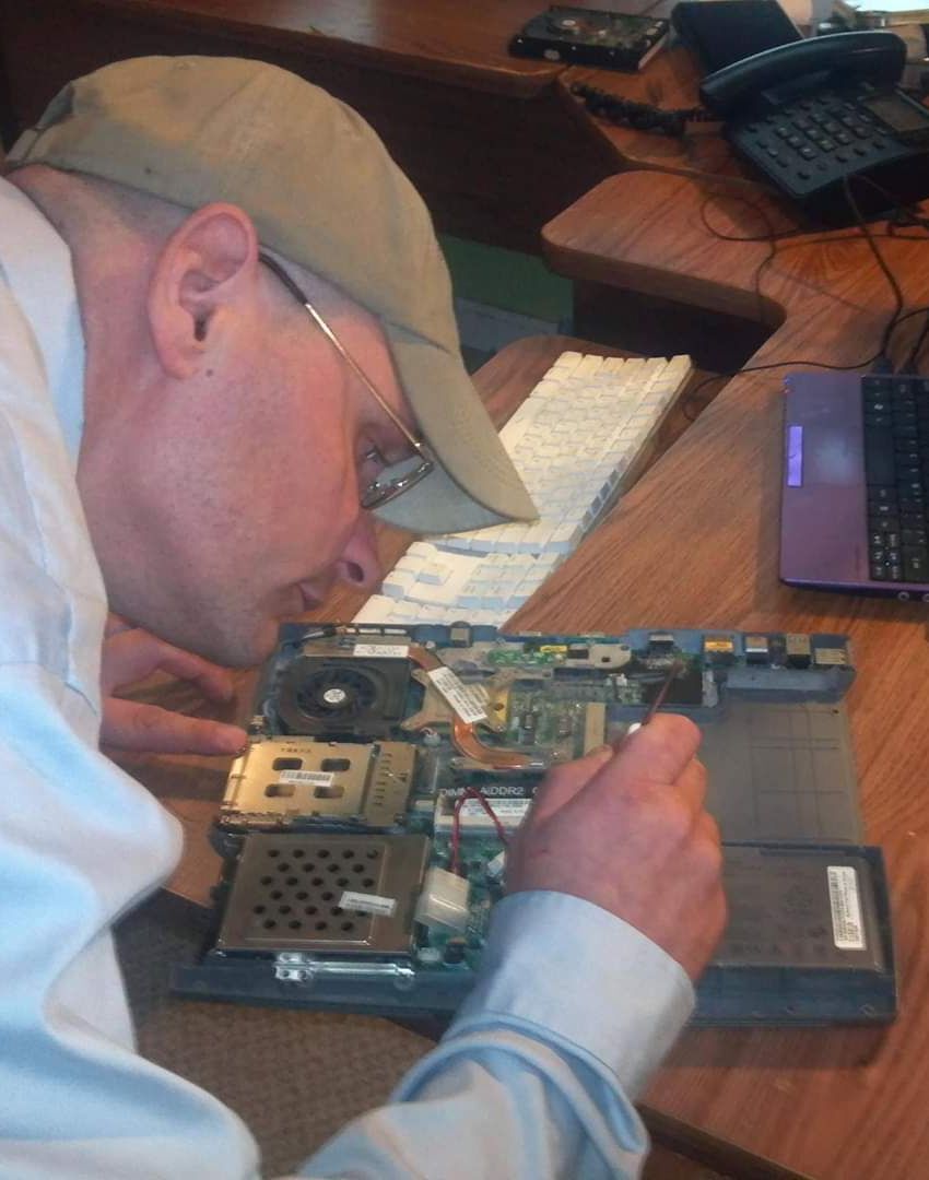 Man Fixing Laptop — Morehead City, NC — On-Site Computing Tech, LLC