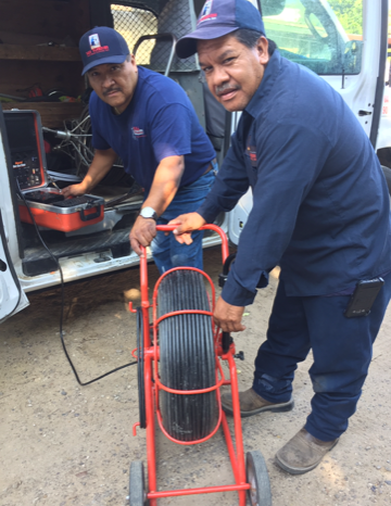 Home Plumbing — Plumber Fixing a Pipe in Laredo, TX