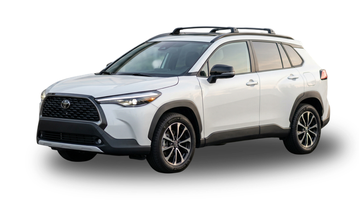 A white Toyota Corolla Cross SUV viewed from the front-quarter angle against a plain white background.