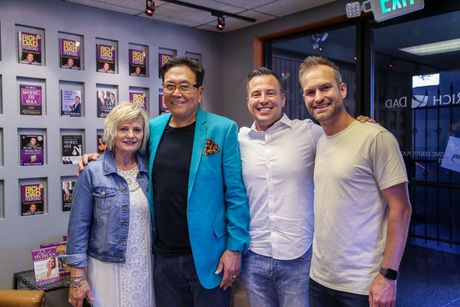 A group of people are posing for a picture in a room.