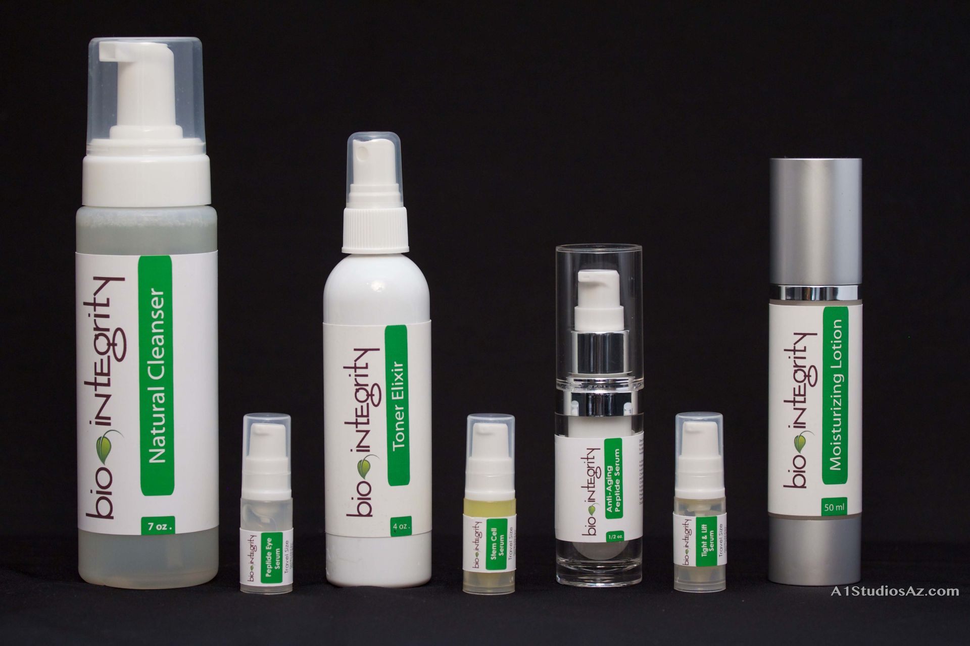 Several bottles of bio integrity products are lined up in a row