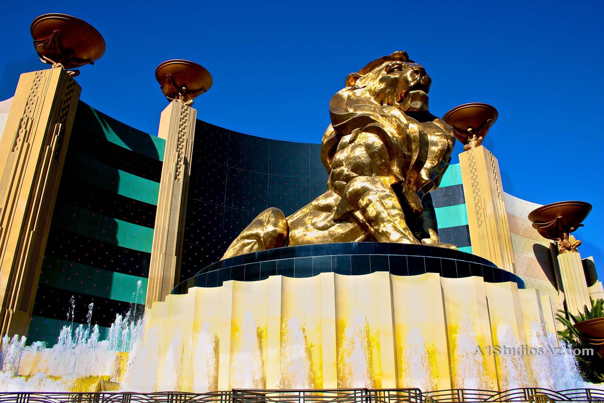 A large gold statue of a lion in front of a building