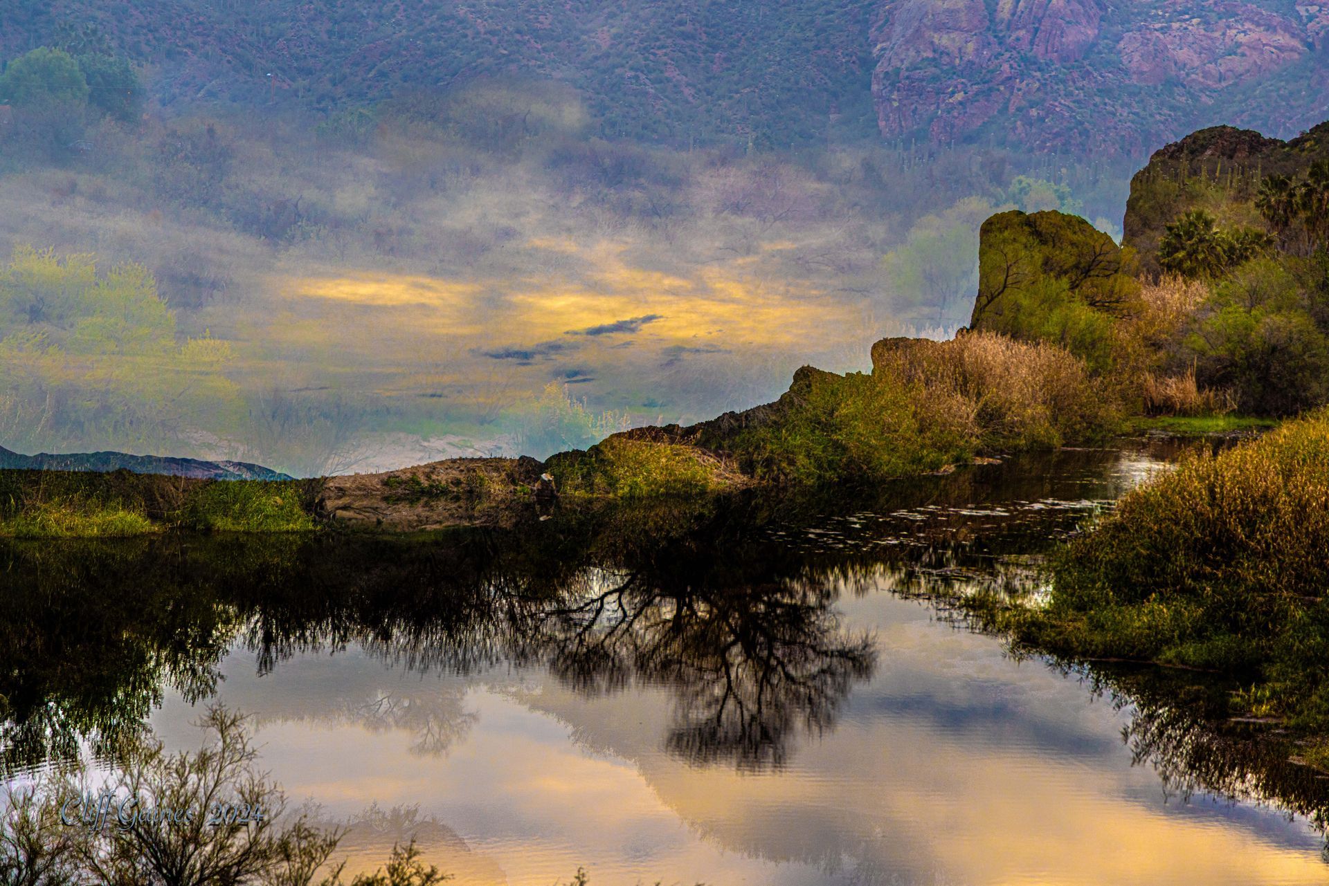 A painting of a lake with trees and mountains in the background.