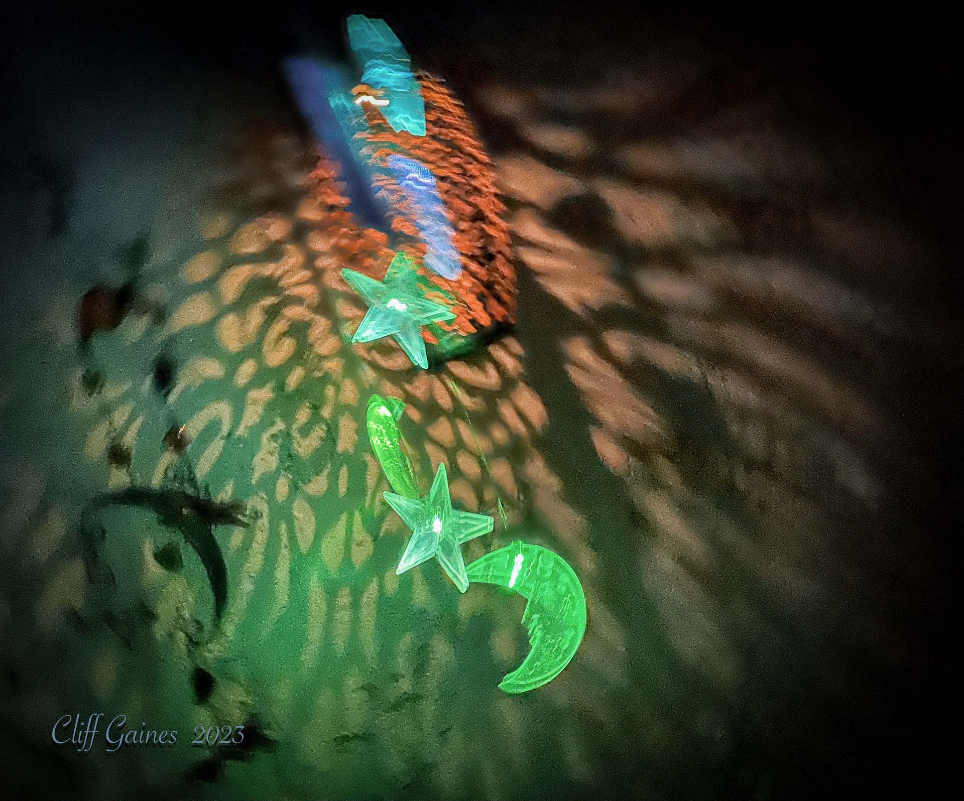 A green star and a green moon are glowing in the dark