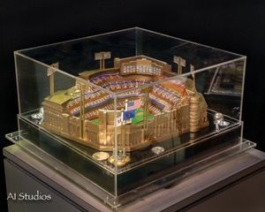 A model of a baseball stadium is in a clear display case.