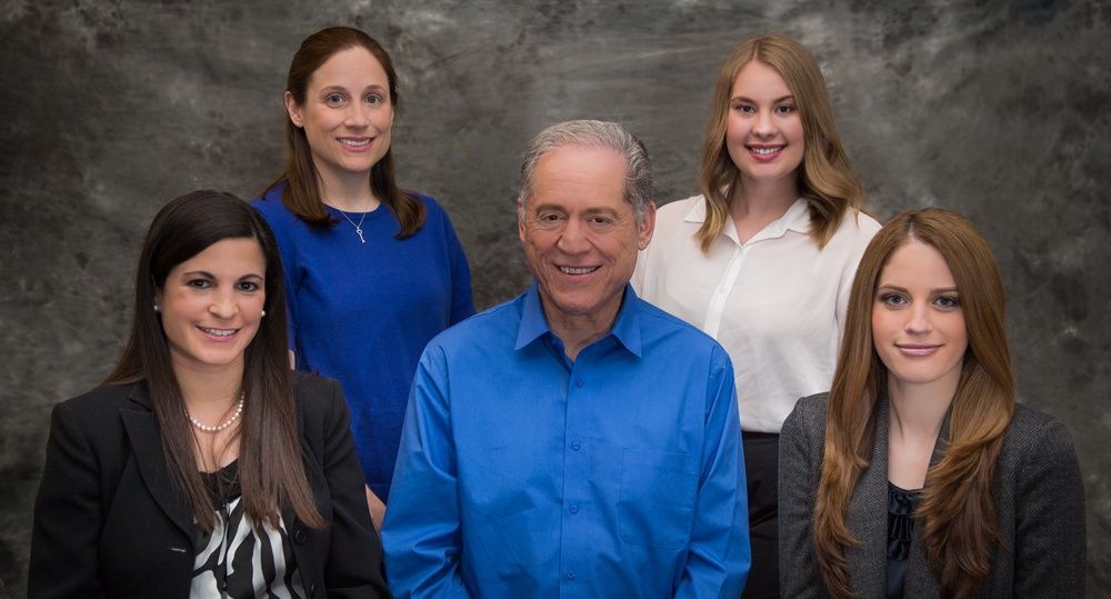 A group of people are posing for a picture together.
