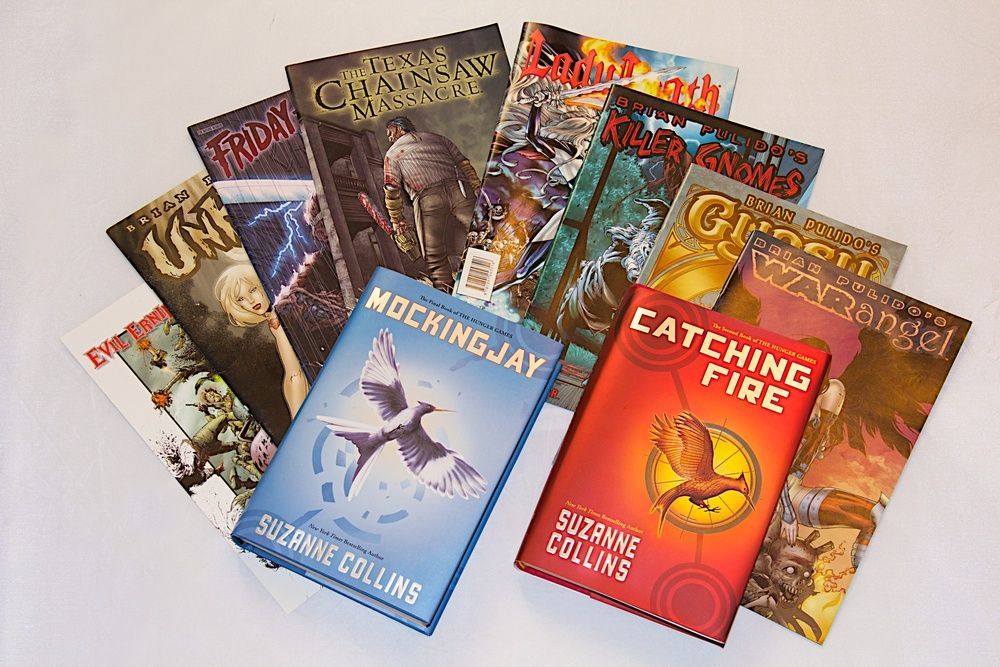 A collection of books including mockingjay and catching fire