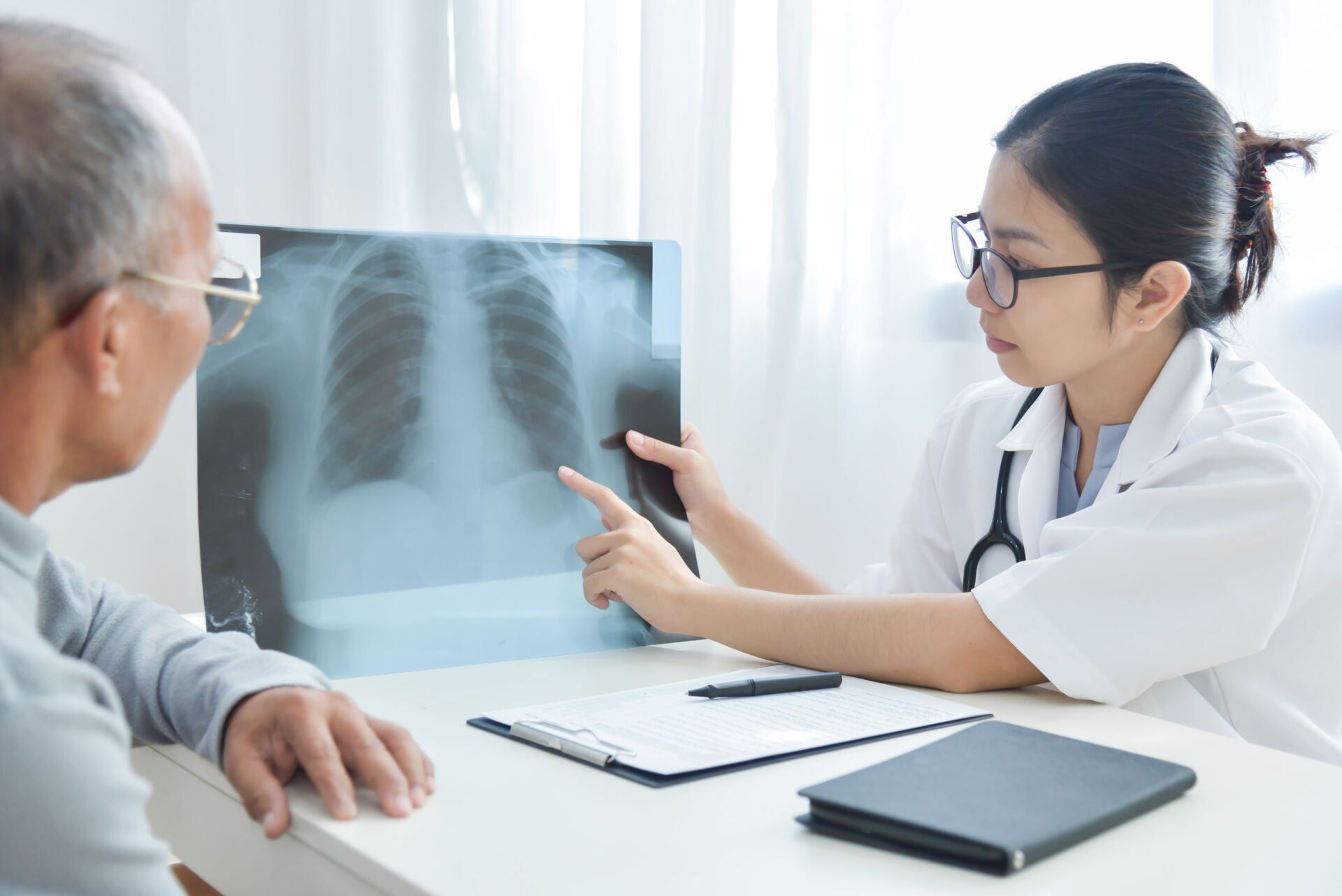 Doctor Showing Chest X Ray to Patient