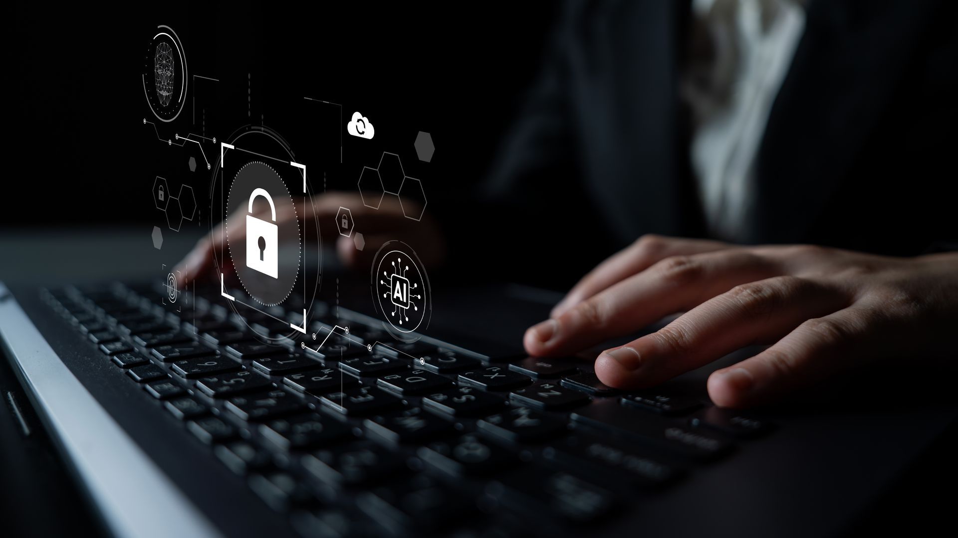 Hands typing on a laptop with a digital lock icon overlaid, representing data security.