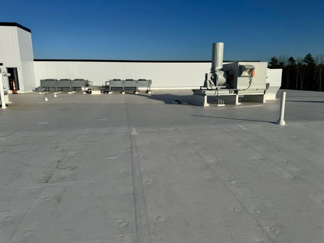 A white roof with a blue sky in the background