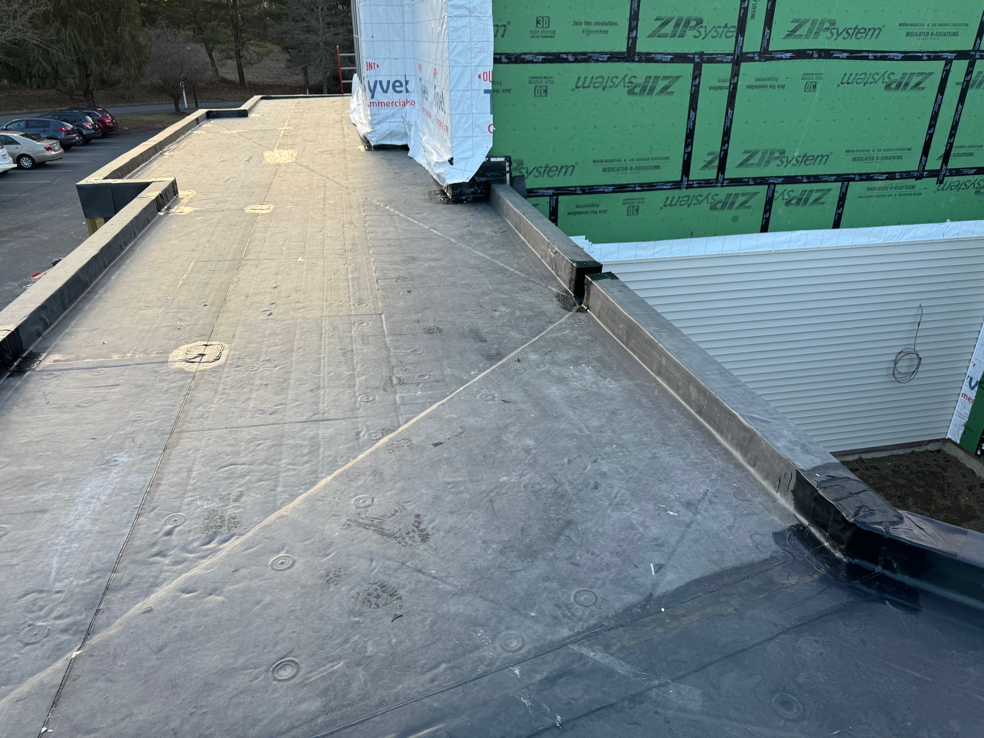 A roof with a lot of green tape on it