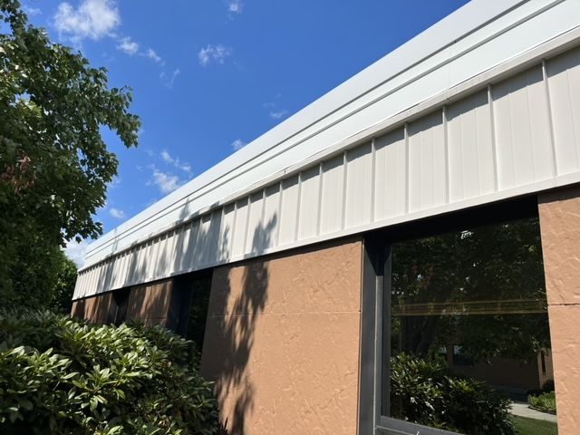 A building with a white roof and a lot of windows