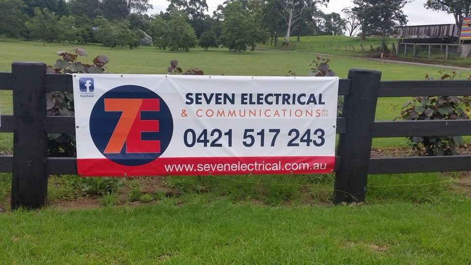 Male Electrician Fixing Light On Ceiling — 7E Integrated Services In Bolwarra Heights NSW