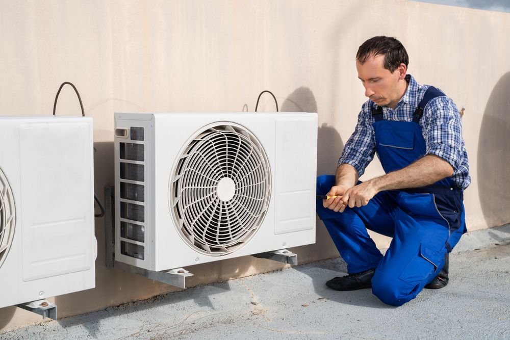 man installing air condition